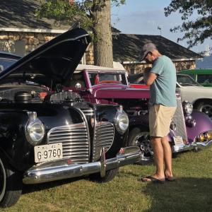 Many cars had their hoods up and windows down so people could get a closer look.