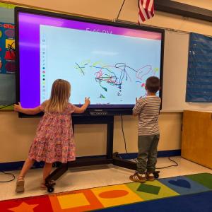 Students play in the Project GROW room, the school's preschool program. 
