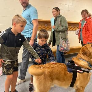 Students pet Norman. 