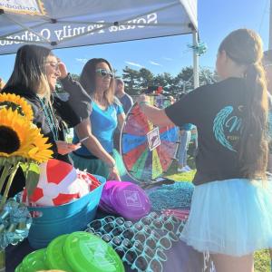 One booth was giving out prizes for spinning a wheel, and each booth had a vase of sunflowers in memory of Maddie.