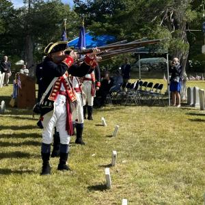 The Henry Knox Color Guard and RTP Living History Color Guard performed a three-musket volley salute. They raised and fired their arms three times.