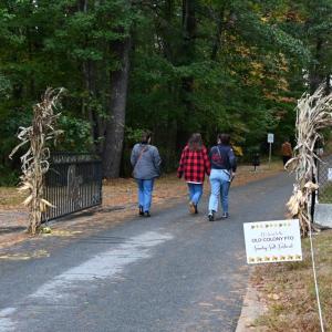 A group walking through the gates to Old Colony’s football field, where the event took place.