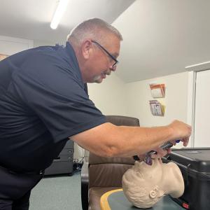 EMS Officer Philip Tura demonstrates how the new video laryngoscopes work. 