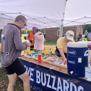 A rider grabs supplies. 