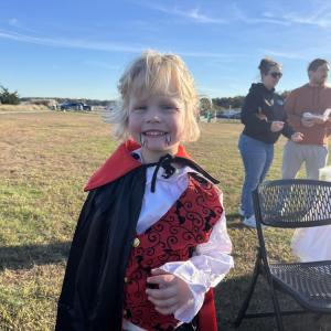 Hunter Hollis, 5, smiles with his freshly-painted vampire teeth to complete his costume at the Oct. 24 trunk or treat. Photos by Grace Roche