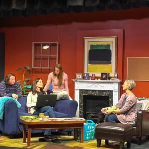 The three letter writers gather around Ruggiero's character as she shares advice. 