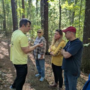 Adam Korejeve shows walk participants a mushroom. Photos source: Eileen Marum