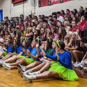 Senior students wave their hands in the air during their class skit, which had a "Toy Story" theme. Photos by Tanvi Kulkarni