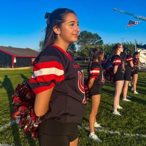 Freshman Sophia Crippin has been cheering since sixth grade. “I’ve always loved coming to the football games and supporting, and I’ve always loved being a cheerleader,” she said.