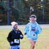 Fiona White and Caroline Hilton begin the trail race with smiles on their faces. Photos by Mari Huglin