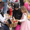 Emmy Philbrook, 5, of Marion stops to grab some candy along the Marion Art Center Halloween Parade route while dressed as a princess. Photos by Grace Ann Natanawan