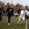 An Old Rochester player runs with the ball past Wareham’s defense during the annual Powderpuff football game on Tuesday, Nov. 21. Photos by Sawyer Smook-Pollitt