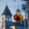 A suncatcher dangles in the window.
