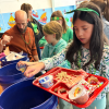 An Old Hammondtown School student sorts through food waste. Photo source: Marion Institute