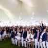 Graduates toss their commencement programs in the air at graduation on Friday, May 22. Photos source: Lawrence Films