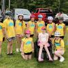 Classmates and friends surround Vivian Jones, center, at the June 2025 Kids Pan-Mass Challenge, a bike-a-thon that raises money for cancer research and treatment. Photos source: Jennifer Jones.