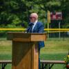 Gary Linehan, principal of Old Colony Regional Vocational Technical High School, speaks at a graduation. Photo by Grace Roche