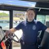 Cameron Wentworth poses in the harbormaster's boat. Photo by Grace Roche