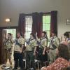 From left: Bryan Correia, Casey Cash, Cole Gretton, Iain McManus, Josh Van Inwegen and Eddie Brown recite the Eagle Charge during the court of honor July 18 at Rochester Grange Hall. Photo by Grace Roche
