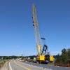 Stationary construction vehicles sit at the Route 6 bridge construction site. Photo by Nick Mossman