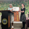 Library Director Kristen Cardoso accepts a plaque from the Rochester Historical Commission on Saturday, Aug. 22. Photo by Tanvi Kulkarni