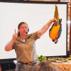 Bethany Boucher holds Jinx, a blue and gold macaw who loves to hang upside down, during a presentation at the Marion Natural History Museum on Monday, Aug. 4. Photos by Grace Roche