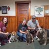 Dog trainers Cristina Fredette and Sherri Swindle, as well as Swindle’s husband, pose with their dogs. Photos by Tanvi Kulkarni