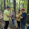 Adam Korejeve shows walk participants a mushroom. Photos source: Eileen Marum