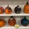 Decorate a pumpkin for a spooky contest.